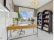 Bright home office featuring a large window, stylish desk, bookshelf, and comfortable seating at 607 Callan View Ave, Wake Forest, NC 27587