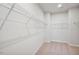 Walk-in closet with carpet and shelving throughout the space at 607 Callan View Ave, Wake Forest, NC 27587
