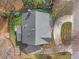 Aerial view of a well-maintained property featuring a playground, spacious backyard, and a private driveway at 6116 Wilkinsburg Rd, Raleigh, NC 27612