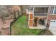Backyard featuring a tiered deck, screened porch, playset, and fenced yard at 6116 Wilkinsburg Rd, Raleigh, NC 27612