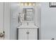 The bathroom has a dual sink vanity with marble countertops and modern lighting at 6116 Wilkinsburg Rd, Raleigh, NC 27612
