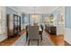 Stylish dining room featuring a chandelier, stylish decor, and seating for six at 6116 Wilkinsburg Rd, Raleigh, NC 27612