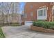 Traditional brick home featuring an attached garage, well-manicured landscaping, and a basketball hoop at 6116 Wilkinsburg Rd, Raleigh, NC 27612
