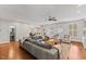 Spacious living room with hardwood floors, neutral walls and abundant natural light at 6116 Wilkinsburg Rd, Raleigh, NC 27612
