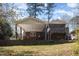 Expansive backyard with a covered patio and screened porch, ideal for entertaining and outdoor activities at 615 Sloan Dr, Cary, NC 27511