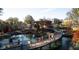 Beautiful park scene showcasing a bridge over a pond, trees and buildings at 615 Sloan Dr, Cary, NC 27511
