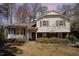 Charming two-story home featuring a classic exterior with a mix of siding and brick accents at 615 Sloan Dr, Cary, NC 27511