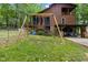 Backyard with a swing set for children to enjoy at 6160 Virgilina Rd, Roxboro, NC 27574