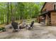 Beautiful backyard with a fire pit surrounded by seating, great for gatherings at 6160 Virgilina Rd, Roxboro, NC 27574