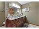Bathroom features a granite countertop, double sink vanity, and modern fixtures at 6160 Virgilina Rd, Roxboro, NC 27574