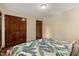 Cozy bedroom with hardwood floors, double closet, and view of the house's grounds at 6160 Virgilina Rd, Roxboro, NC 27574