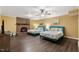 Spacious bedroom featuring two beds and a cozy brick fireplace, creating a relaxing ambiance at 6160 Virgilina Rd, Roxboro, NC 27574