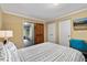 Bedroom featuring a bed, desk, and closet at 6160 Virgilina Rd, Roxboro, NC 27574