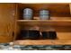 A glimpse into a kitchen cabinet with neatly organized plates and bowls at 6160 Virgilina Rd, Roxboro, NC 27574