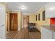 Spacious game room with hardwood floors, wooden door and foosball table at 6160 Virgilina Rd, Roxboro, NC 27574