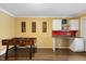 A spacious game room featuring a foosball table, work area, and hardwood flooring at 6160 Virgilina Rd, Roxboro, NC 27574