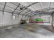 Spacious garage with high ceilings, storage, and ample room for vehicles and equipment at 6160 Virgilina Rd, Roxboro, NC 27574