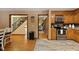 Spacious open-concept kitchen with stainless steel appliances, ample cabinet space, and hardwood floors at 6160 Virgilina Rd, Roxboro, NC 27574