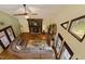 Spacious living room with a cozy fireplace, large windows, and comfortable seating at 6160 Virgilina Rd, Roxboro, NC 27574