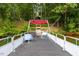 Pontoon boat on the lake with seating and a scenic view of the lake and shoreline at 6160 Virgilina Rd, Roxboro, NC 27574