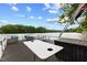 View of a pontoon boat with table and storage box with beautiful lake view at 6160 Virgilina Rd, Roxboro, NC 27574