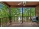 Inviting porch with comfortable seating and views of the lush surrounding forest at 6160 Virgilina Rd, Roxboro, NC 27574