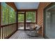 Relaxing screened porch with views of the natural landscape, perfect for outdoor enjoyment at 6160 Virgilina Rd, Roxboro, NC 27574