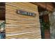 Bamboo facade with a welcome sign for a home near a lake at 6160 Virgilina Rd, Roxboro, NC 27574