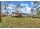 View of the backyard and deck of this single Gathering home with gray siding at 715 Shay Dr, Durham, NC 27704