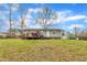 View of the backyard and deck of this single Gathering home with gray siding at 715 Shay Dr, Durham, NC 27704
