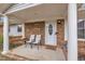 Charming front porch with chairs, swing, and a welcoming entrance, perfect for enjoying the outdoors at 715 Shay Dr, Durham, NC 27704