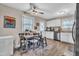Eat-in kitchen featuring white cabinets, stainless steel appliances, and stylish flooring, perfect for casual dining at 715 Shay Dr, Durham, NC 27704