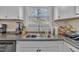 Functional kitchen area featuring stainless steel appliances, double basin sink and ample counter space at 715 Shay Dr, Durham, NC 27704