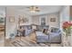 Inviting living room with a comfortable sectional sofa, stylish rug, and a ceiling fan for added comfort at 715 Shay Dr, Durham, NC 27704
