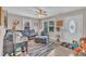Cozy living room featuring a large sectional, neutral walls, natural light, and a view to the front door at 715 Shay Dr, Durham, NC 27704