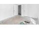 A look at a white walled bedroom with adjacent open doorway, awaiting finishing touches at 740 Long Ave, Rocky Mount, NC 27801