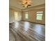 Primary bedroom featuring neutral walls, gray flooring and natural light at 78 Florence Dr, Clayton, NC 27527