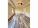 This bedroom features hardwood floors, neutral walls, tray ceilings, and a ceiling fan at 78 Florence Dr, Clayton, NC 27527