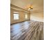 This bedroom features hardwood floors, neutral walls, tray ceilings, and a ceiling fan at 78 Florence Dr, Clayton, NC 27527