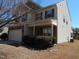 A charming two-story home with a two car garage, stone accents, and manicured front yard at 78 Florence Dr, Clayton, NC 27527