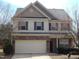 Two-story home featuring brick accents, vinyl siding, dormer and a two car garage at 78 Florence Dr, Clayton, NC 27527