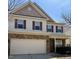 Charming two-story home featuring brick accents, vinyl siding and a two car garage at 78 Florence Dr, Clayton, NC 27527