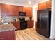 Spacious kitchen featuring stainless steel appliances, granite countertops and wood cabinets at 78 Florence Dr, Clayton, NC 27527