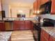 Spacious kitchen with stainless steel appliances, granite countertops and wood cabinets at 78 Florence Dr, Clayton, NC 27527
