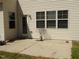 This patio includes a back door, lots of windows, and a small lawn at 78 Florence Dr, Clayton, NC 27527