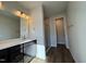 Contemporary bathroom featuring a spacious shower and stylish vanity with plentiful counter space at 802 Hillfarm Dr, Wake Forest, NC 27587