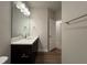 Modern bathroom with a single vanity, clean lines, and a well-lit mirror at 802 Hillfarm Dr, Wake Forest, NC 27587