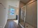 Modern bathroom with glass-enclosed shower, offering a luxurious and bright space at 802 Hillfarm Dr, Wake Forest, NC 27587