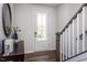 Welcoming entryway with stylish décor, a staircase, and a bright front door, creating a positive first impression at 802 Hillfarm Dr, Wake Forest, NC 27587