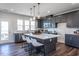 Open kitchen with center island, modern appliances, and ample natural light at 802 Hillfarm Dr, Wake Forest, NC 27587